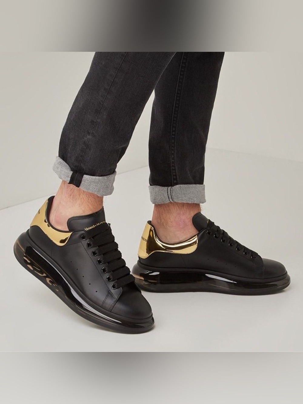 Alexander McQueen Black Sneakers with Gold Heel Accent